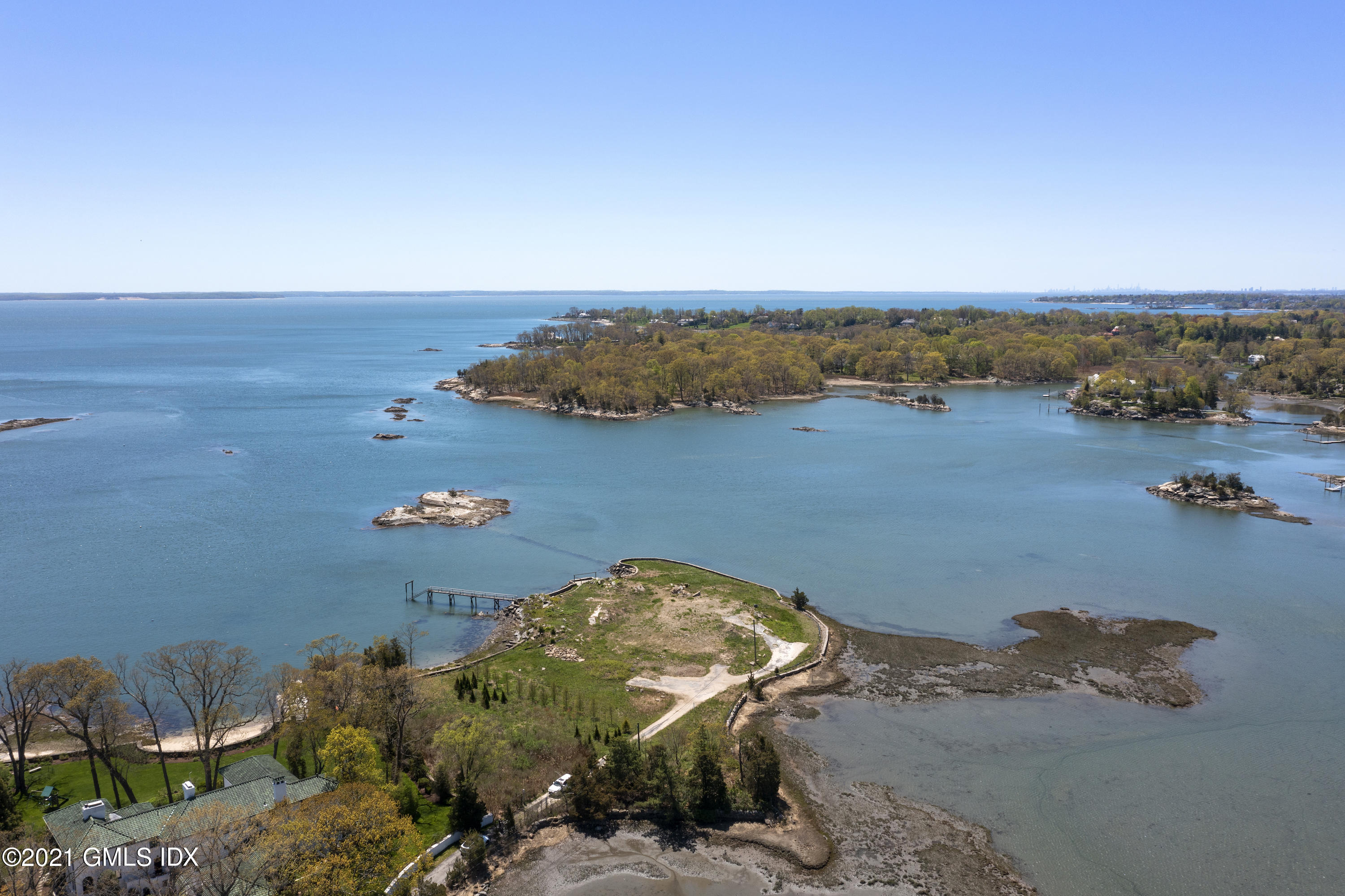 122 Delafield Island Road Darien, CT 06820 - Photo 2 of 34 a view of a lake with a mountain