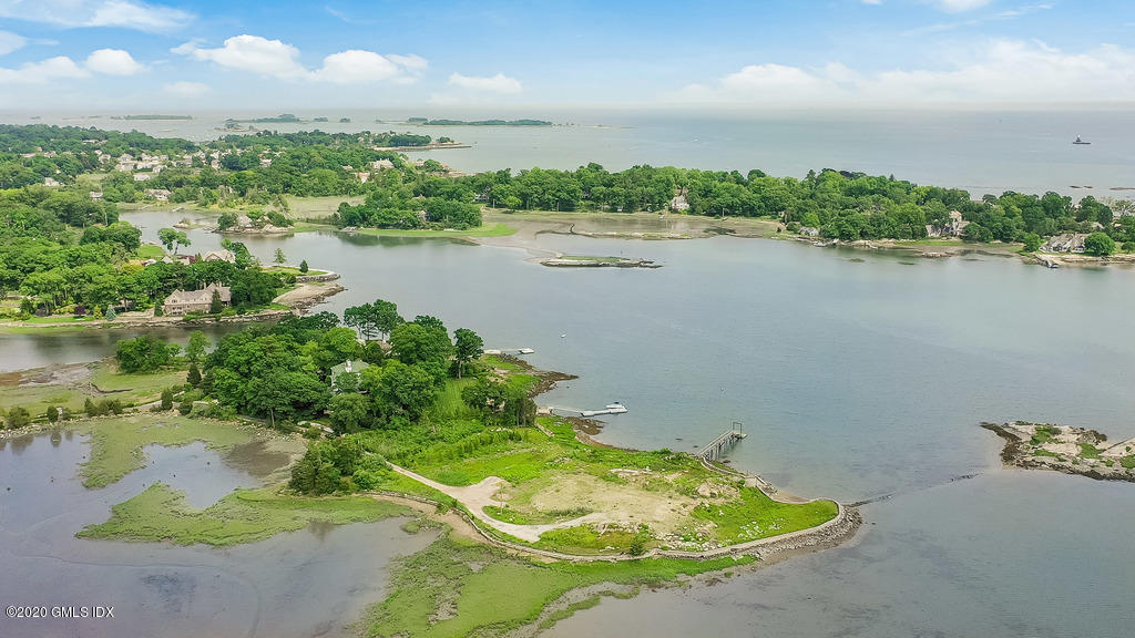 122 Delafield Island Road Darien, CT 06820 - Photo 21 of 34 a view of a lake with a mountain in the background