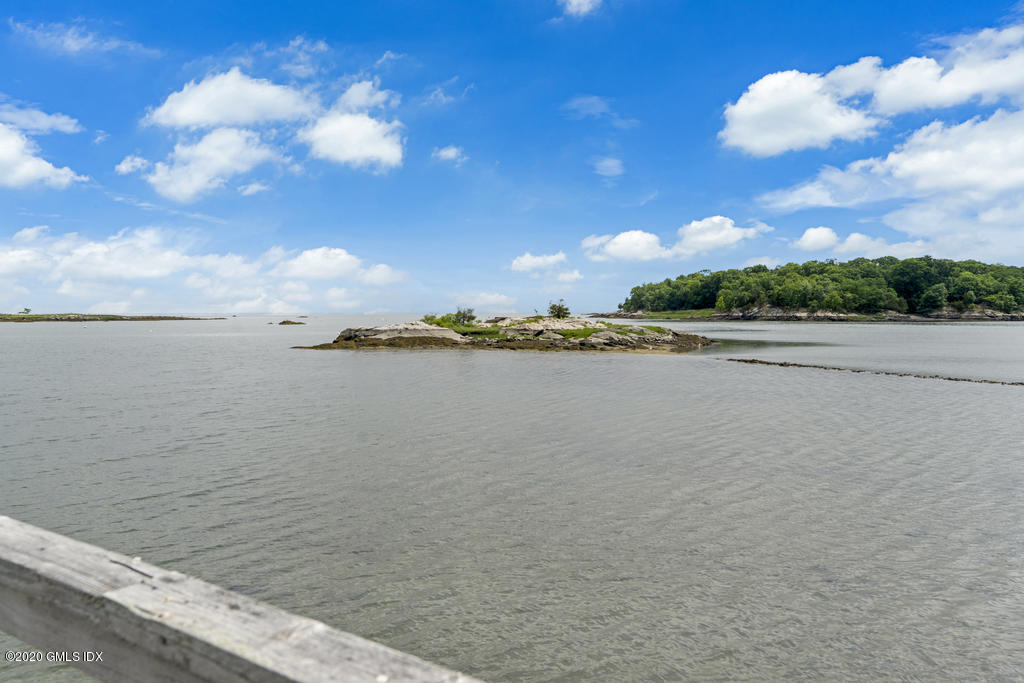 122 Delafield Island Road Darien, CT 06820 - Photo 30 of 34 a view of a lake and sunset