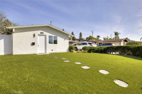 a front view of a house with yard