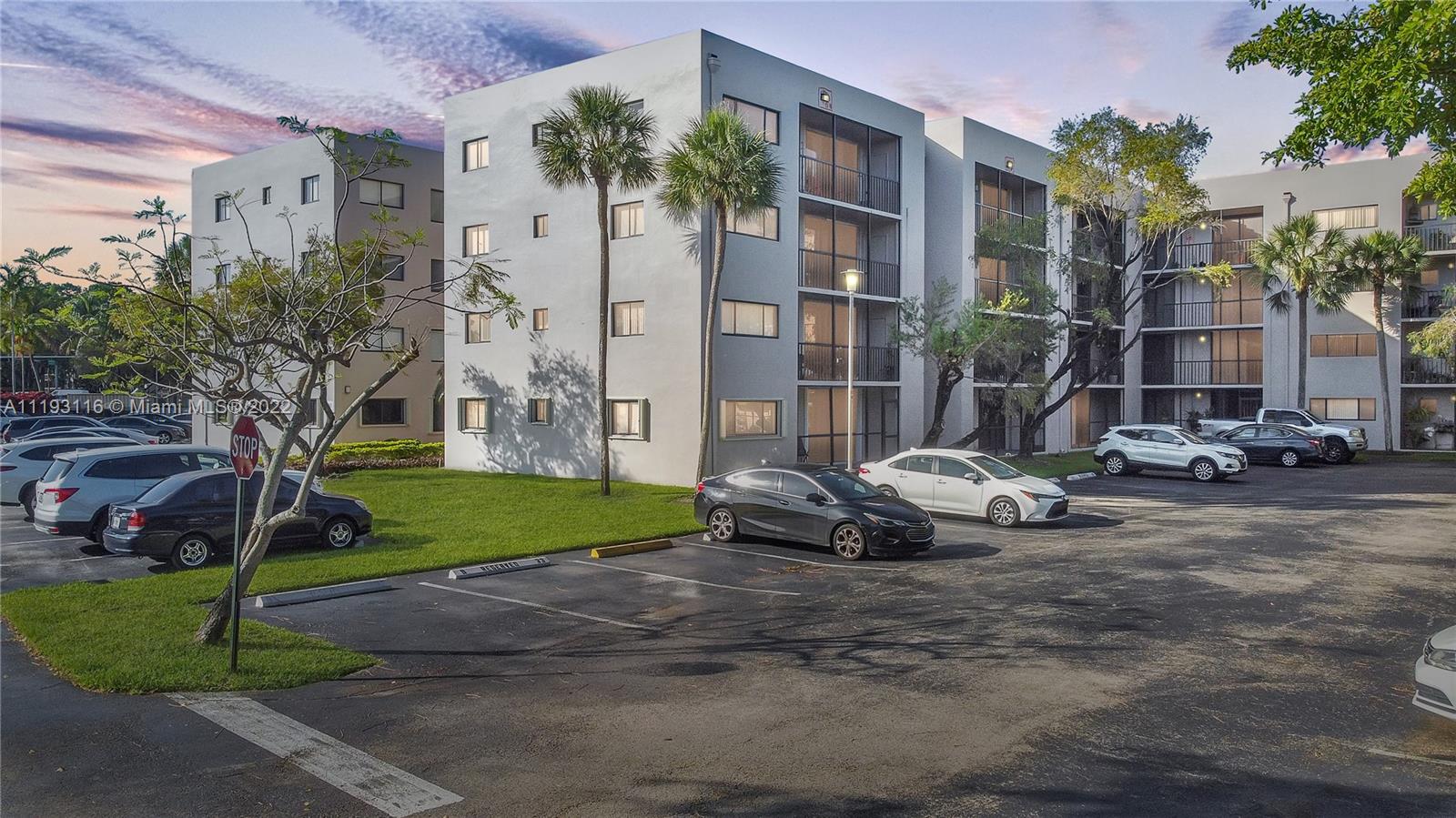 a car parked in front of brick building