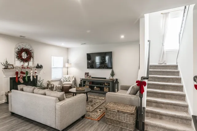 a living room with furniture and a flat screen tv