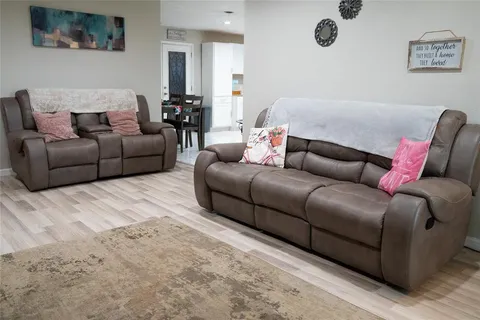 a living room with furniture and a couch