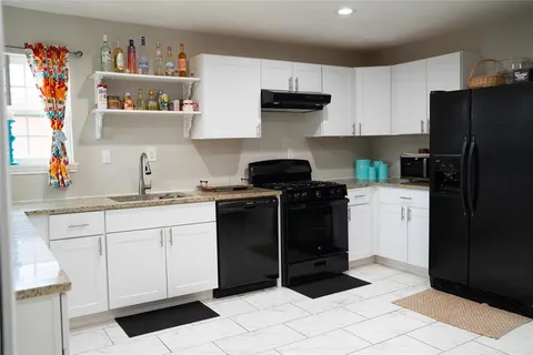 a kitchen with a sink and cabinets