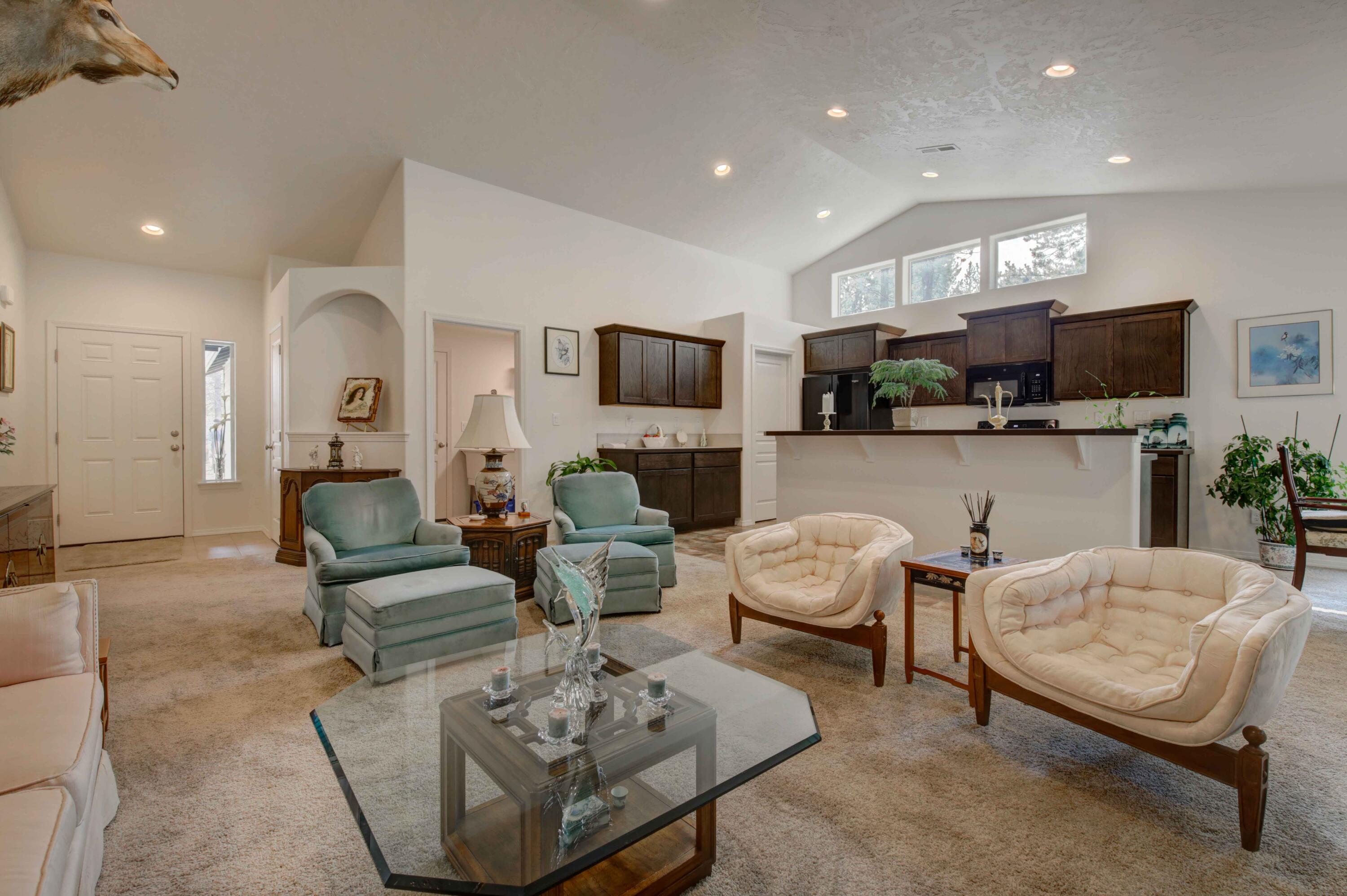 17160 Elsinore Road Bend, OR 97707 - Photo 7 of 47 a living room with fireplace furniture and a flat screen tv