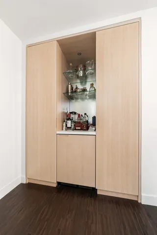 a view of washer and dryer with wooden floor