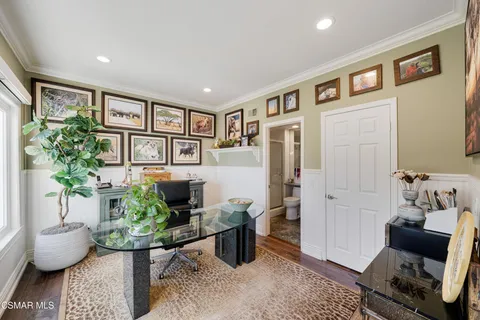 a view of an entryway with wooden floor