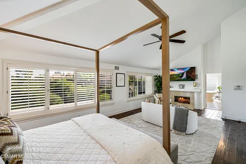 a bathroom with a double vanity sink mirror bathtub and shower