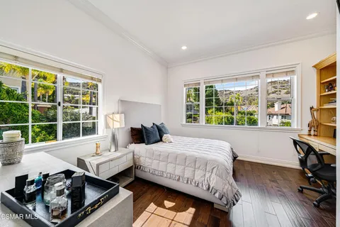 a backyard of a house with plants and trees
