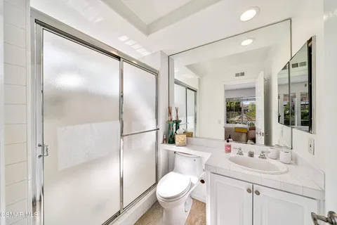 a view of swimming pool with outdoor seating and plants