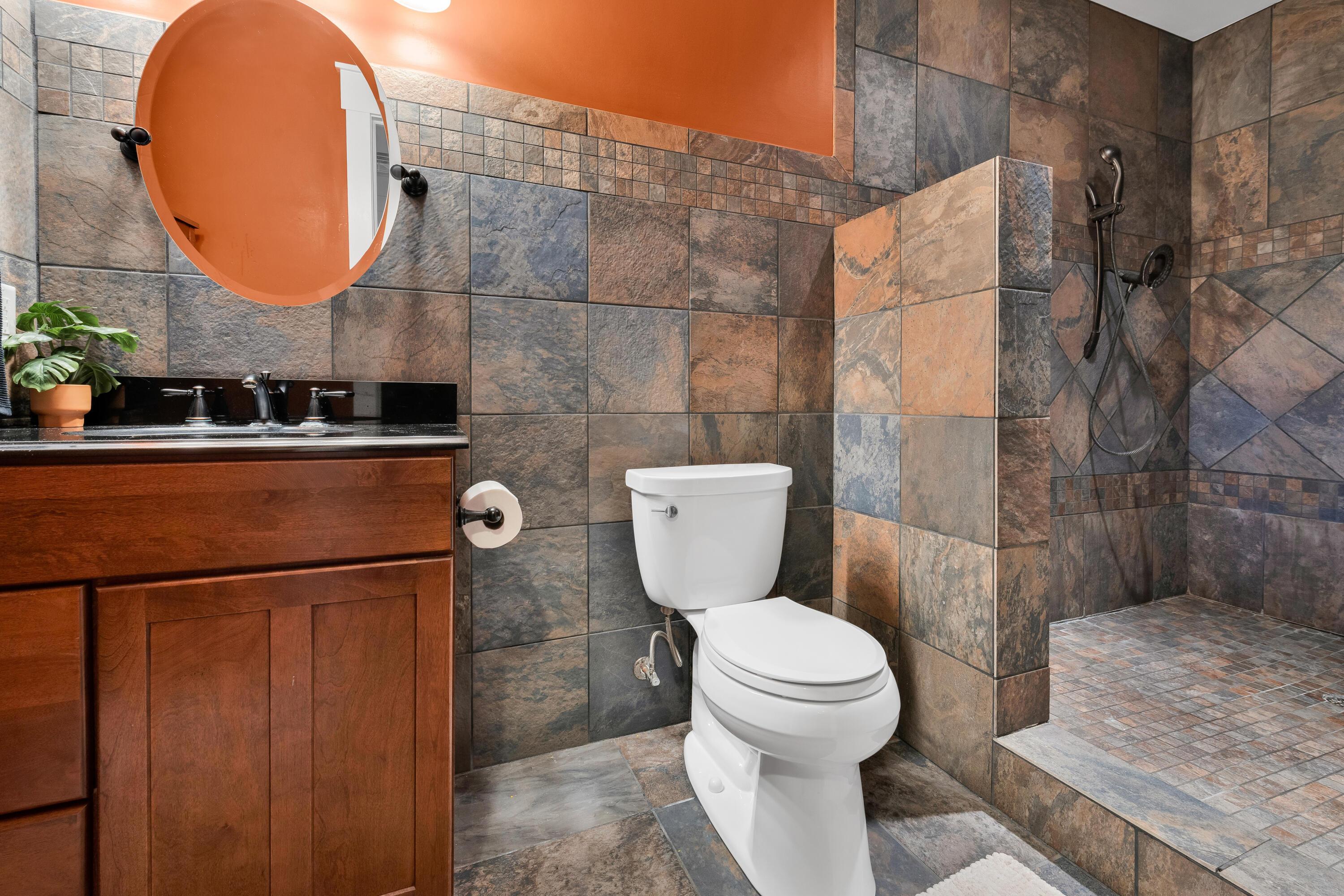 16689 Bailor Road Laurelville, OH 43135 - Photo 50 of 73 • Ceramic tile flooring
• Half ceramic tile walls &
burgundy painted walls
• Enclosed vanity with single
bowl, granite sinktop
• 4 bulb wall light
• Shower stall with rain head
& ceramic tile surround
• Ceiling exhaust