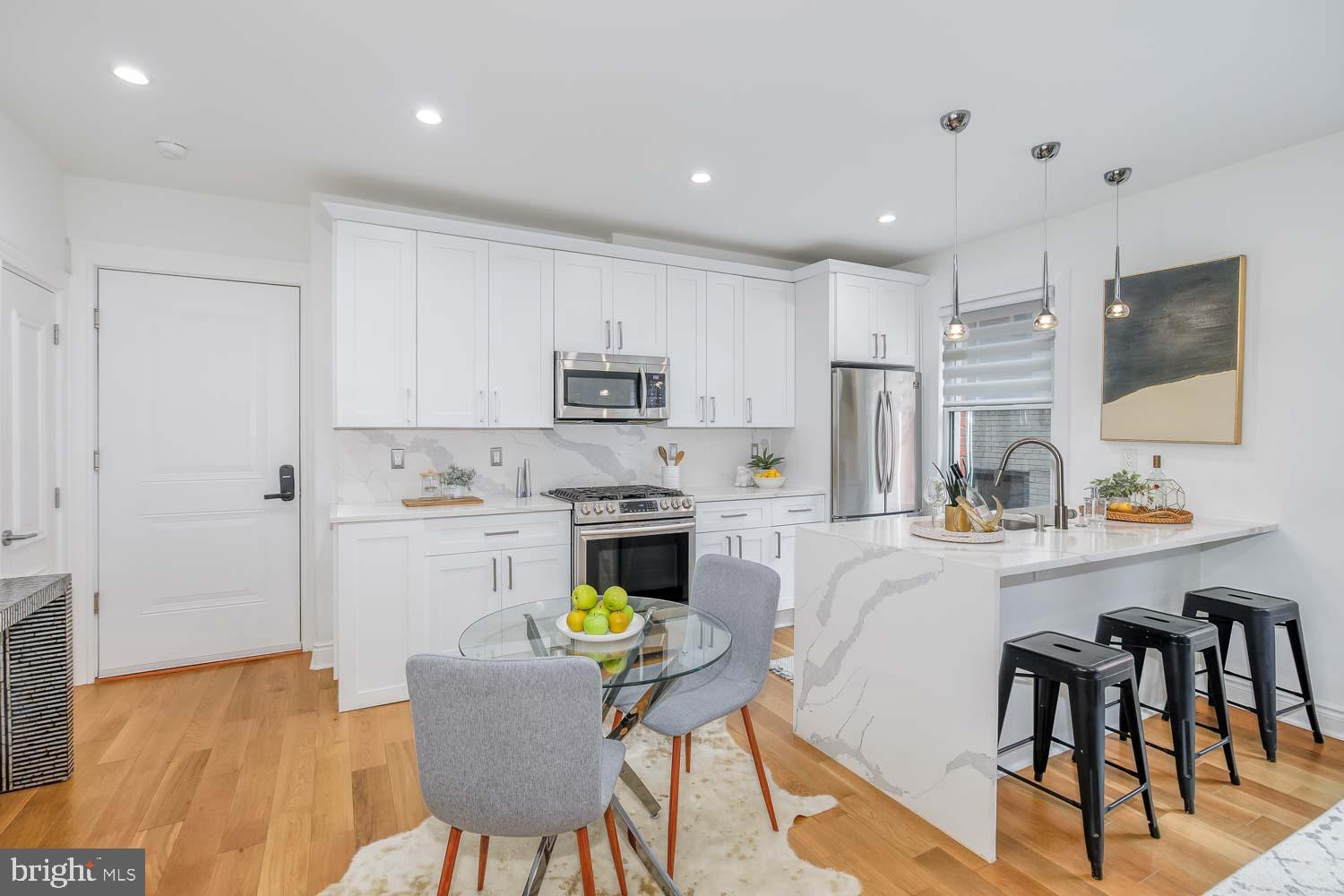 317 3rd Street Southeast, Unit 26 Washington, DC 20003 - Photo 4 of 18 a kitchen that has a cabinets counter space and appliances