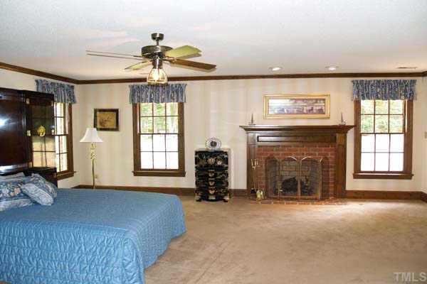 2201 Customs House Court Raleigh, NC 27615 - Photo 7 of 10 a living room with furniture large window and fireplace