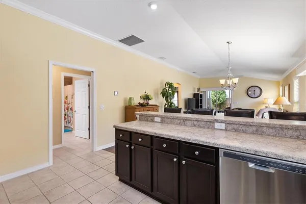 a kitchen with a sink and a refrigerator