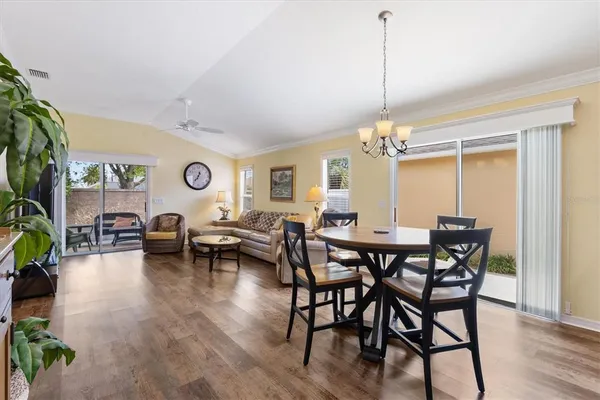 a view of a dining room with furniture and window