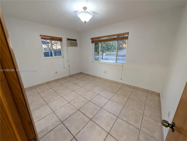 an empty room with windows