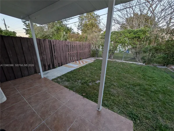 a view of backyard with green space