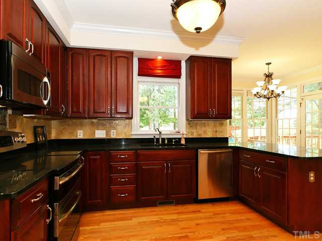 4820 Salem Ridge Road Holly Springs, NC 27540 - Photo 3 of 12 Updated kitchen with granite countertops and cherry cabinetry with soft close drawers Kitchen