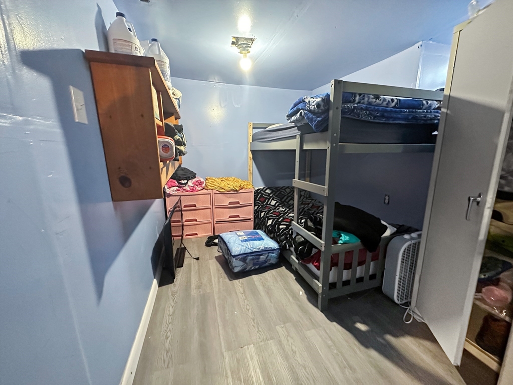 802 2nd Street Fall River, MA 02721 - Photo 11 of 12 a bed room with furniture and a wooden floor