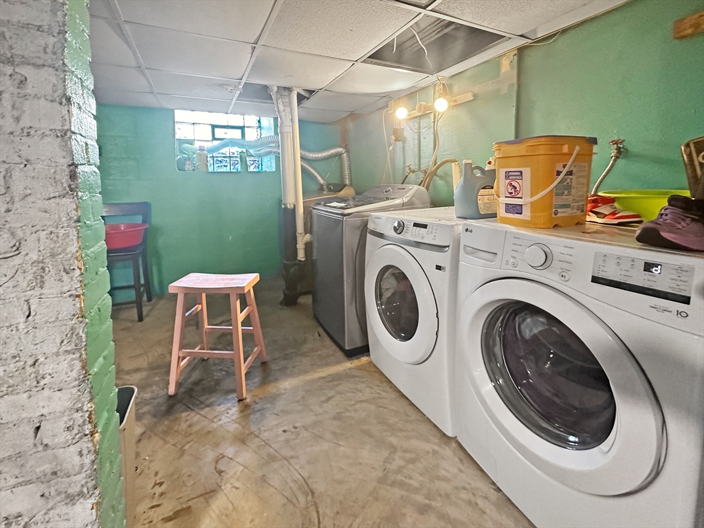 802 2nd Street Fall River, MA 02721 - Photo 12 of 12 a view of a storage & utility room with washer and dryer