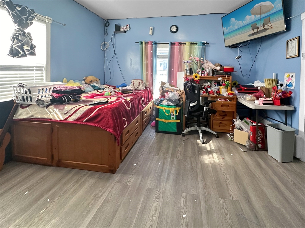 802 2nd Street Fall River, MA 02721 - Photo 7 of 12 a bed room with a bed and a window