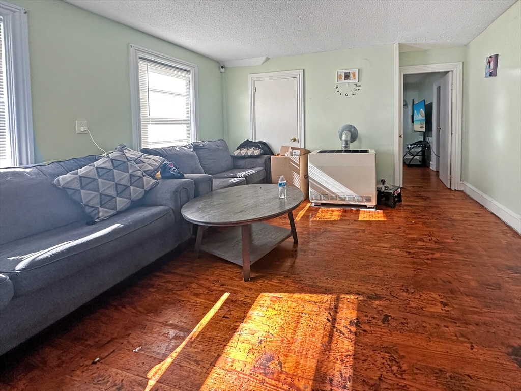 802 2nd Street Fall River, MA 02721 - Photo 10 of 12 a living room with furniture and a window