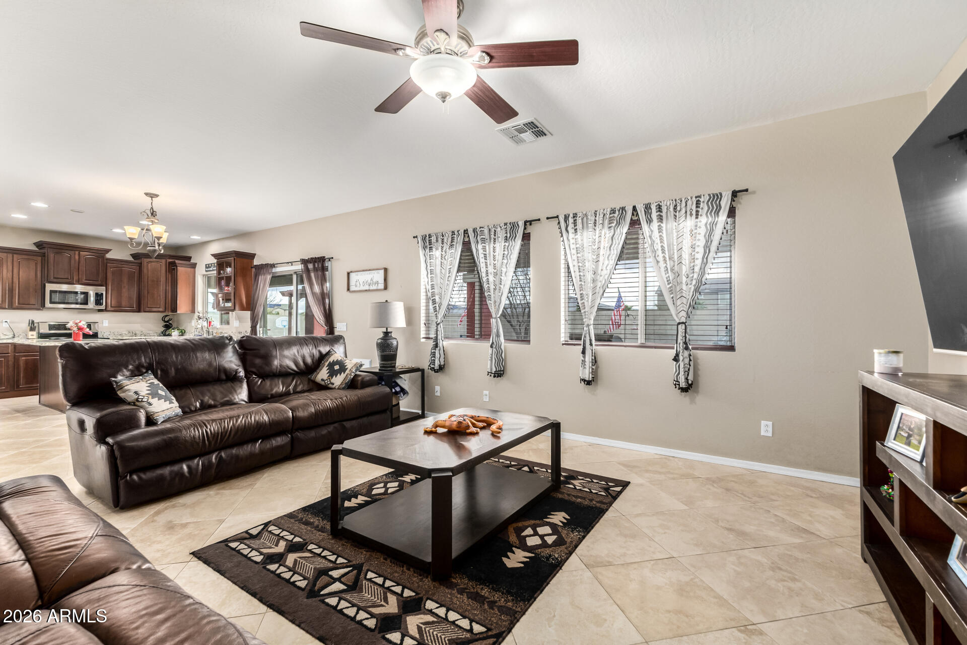 24541 Plum Road Florence, AZ 85132 - Photo 10 of 47 a living room with furniture and a flat screen tv