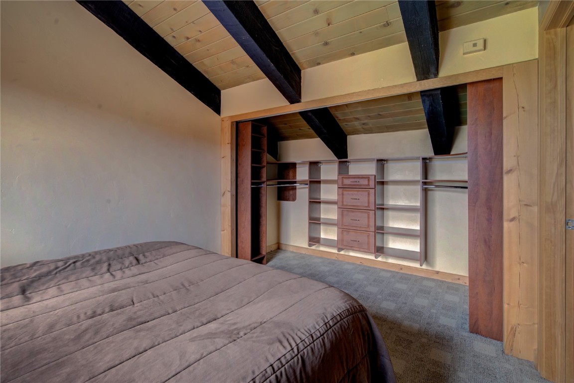 1945 Cornice Road, Unit 2431 Steamboat Springs, CO 80487 - Photo 12 of 24 a bedroom with a bed and a window