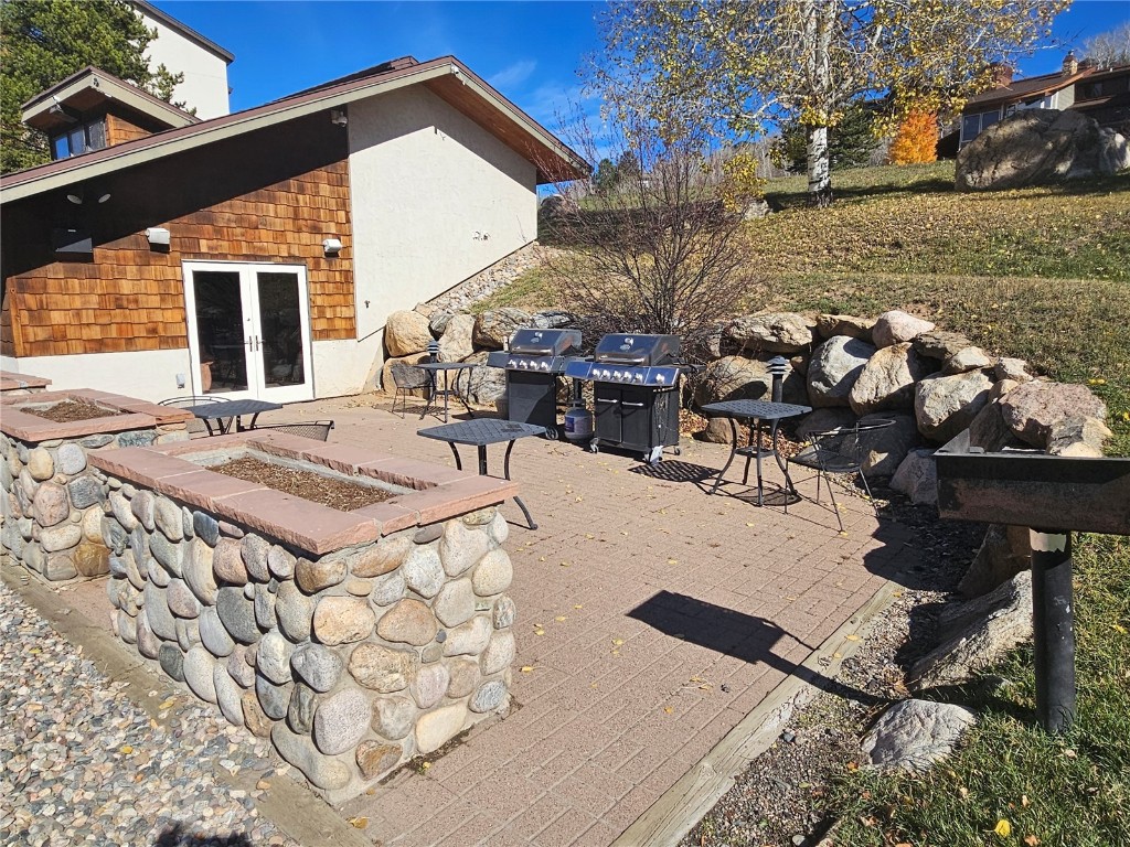 1945 Cornice Road, Unit 2431 Steamboat Springs, CO 80487 - Photo 20 of 24 a view of a backyard with sitting area