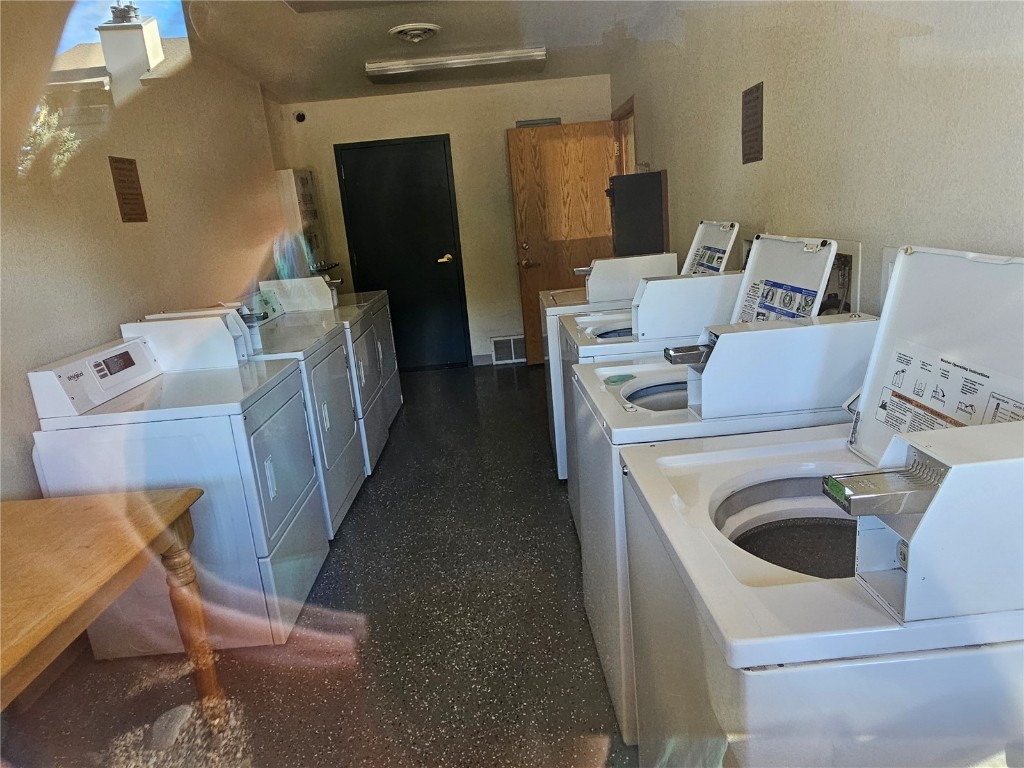 1945 Cornice Road, Unit 2431 Steamboat Springs, CO 80487 - Photo 23 of 24 a utility room with dryer and washer