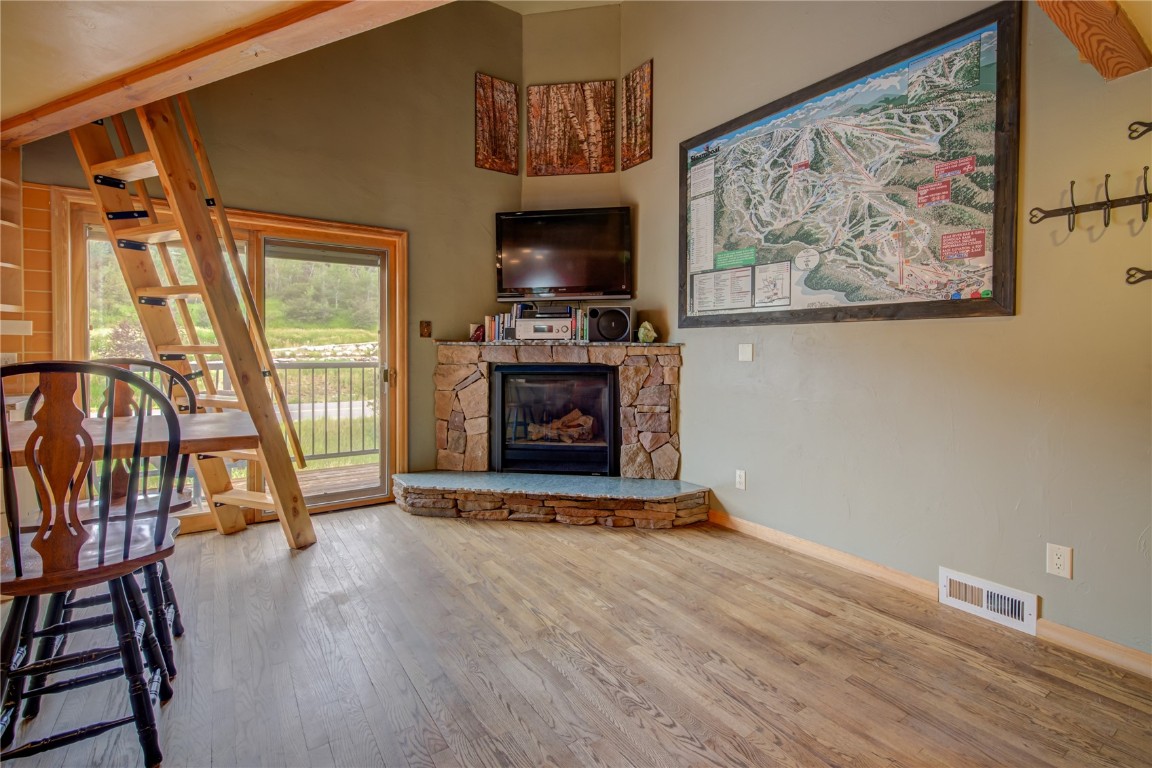 1945 Cornice Road, Unit 2431 Steamboat Springs, CO 80487 - Photo 3 of 24 a view of an empty room with wooden floor and a window