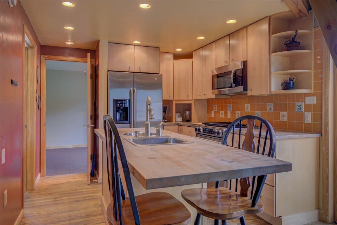 1945 Cornice Road, Unit 2431 Steamboat Springs, CO 80487 - Photo 4 of 24 a view of a dining room with furniture and wooden floor