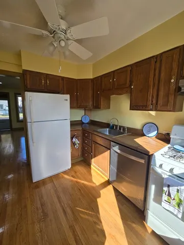 a kitchen with a sink and a refrigerator