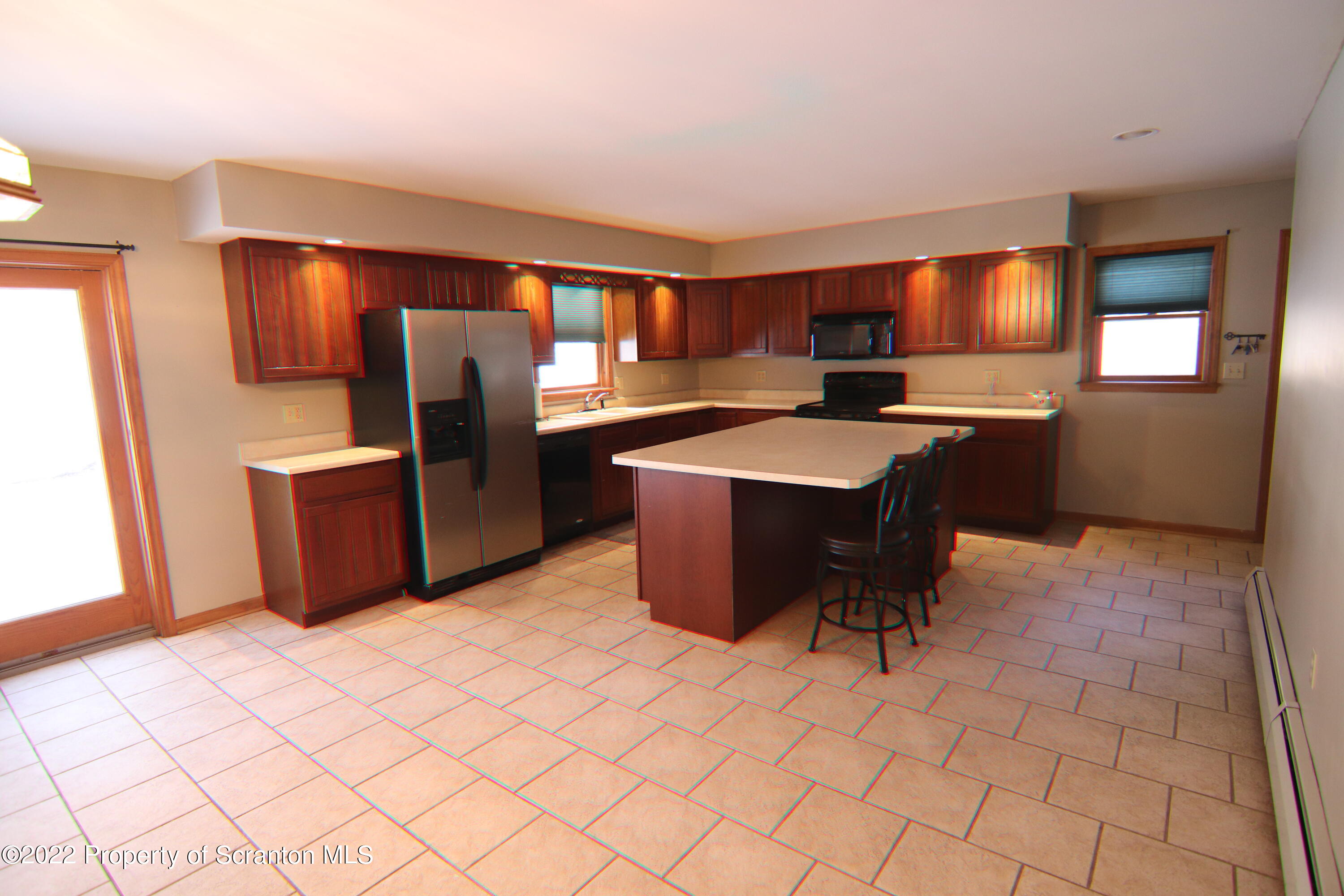 255 Billings Mill Road Tunkhannock, PA 18657 - Photo 20 of 47 a kitchen with stainless steel appliances granite countertop a sink counter space and a refrigerator