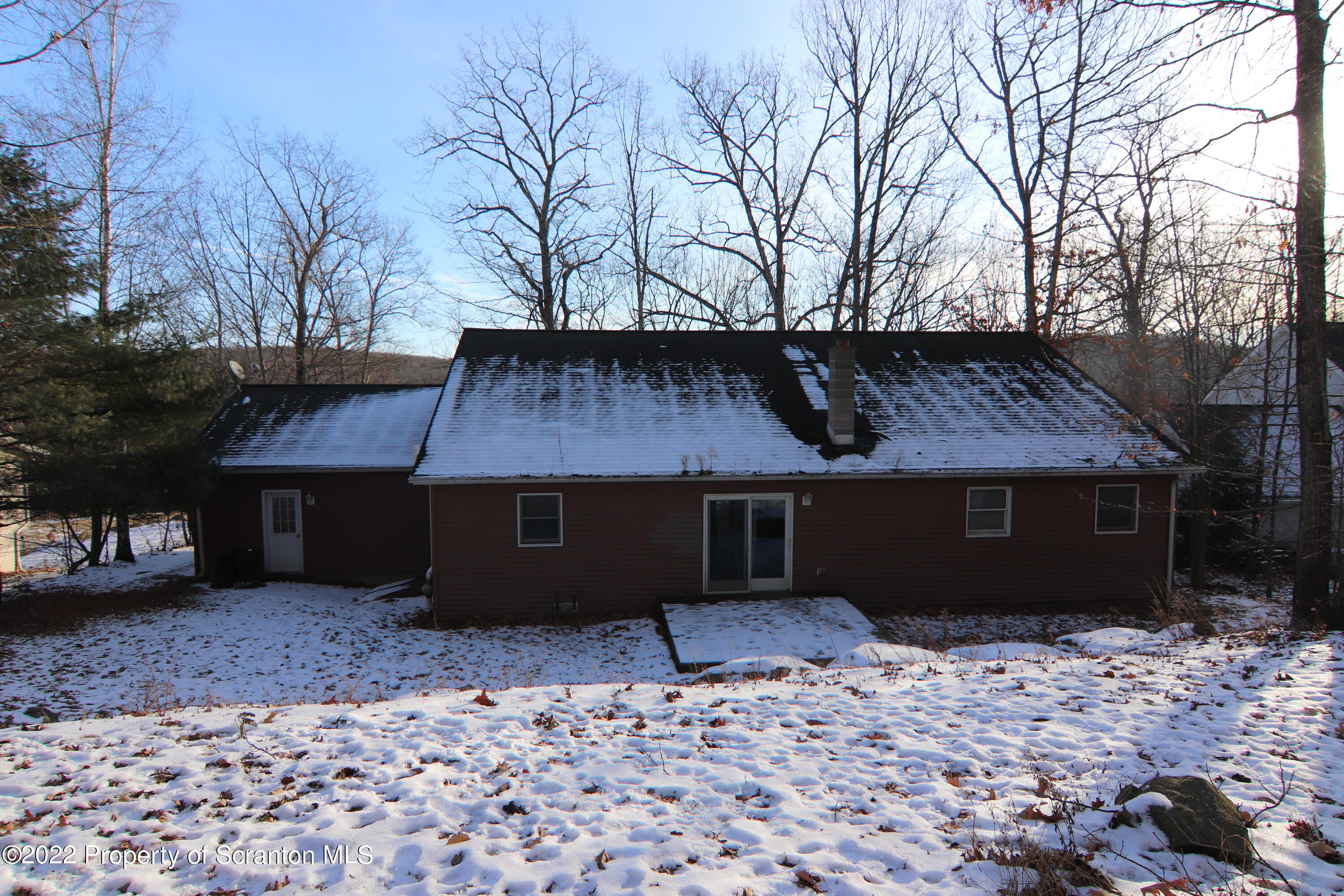 255 Billings Mill Road Tunkhannock, PA 18657 - Photo 4 of 47 a front view of a house with a yard