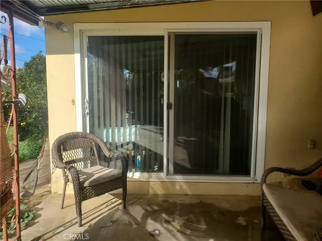 a view of a door and chair in front of a door