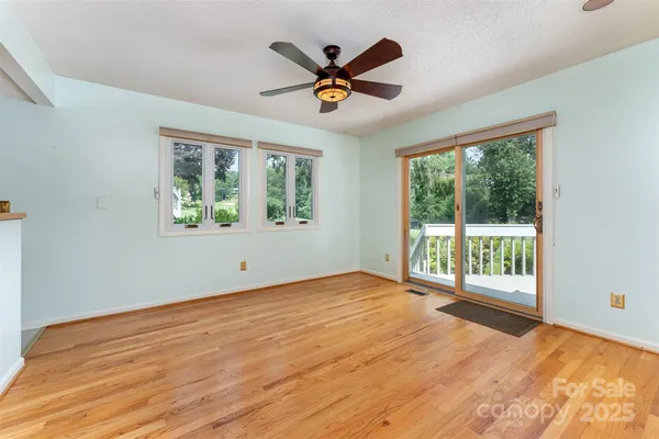 a view of an empty room with a window
