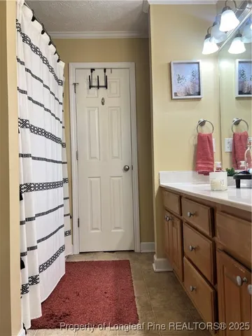 a view of cabinets with wooden floor and windows