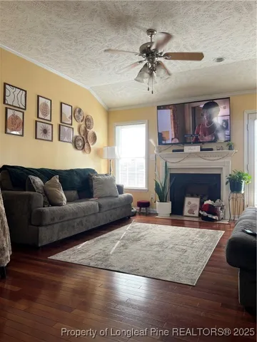 a living room with furniture and a fireplace