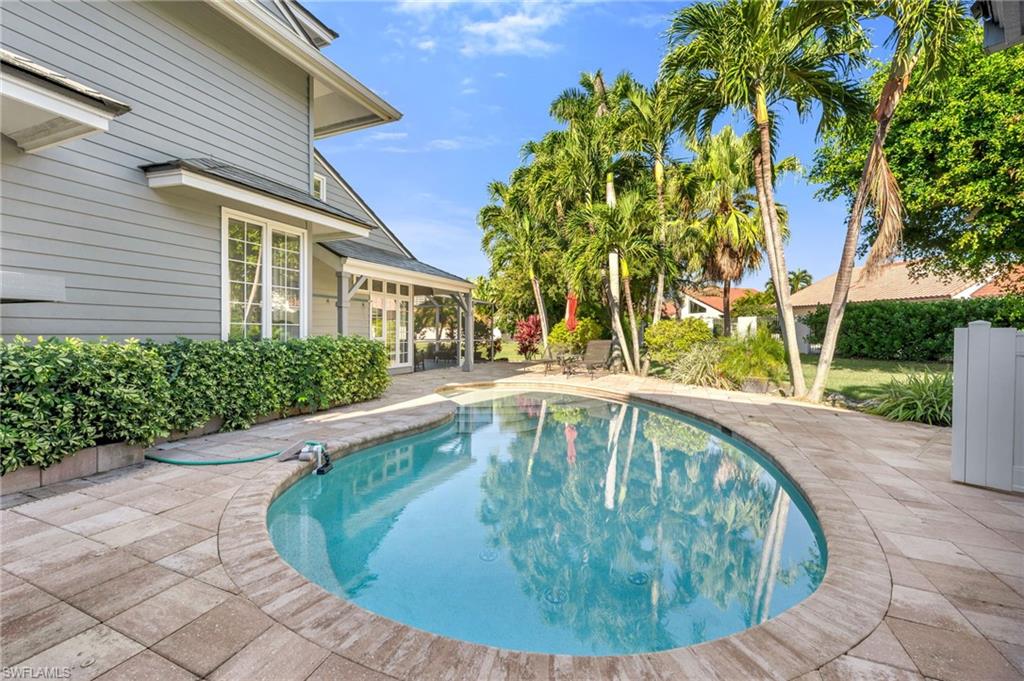 667 Bridge Way Lane Naples, FL 34108 - Photo 18 of 18 a view of outdoor space yard swimming pool