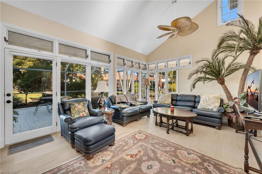 667 Bridge Way Lane Naples, FL 34108 - Photo 5 of 18 a living room with furniture and a large window