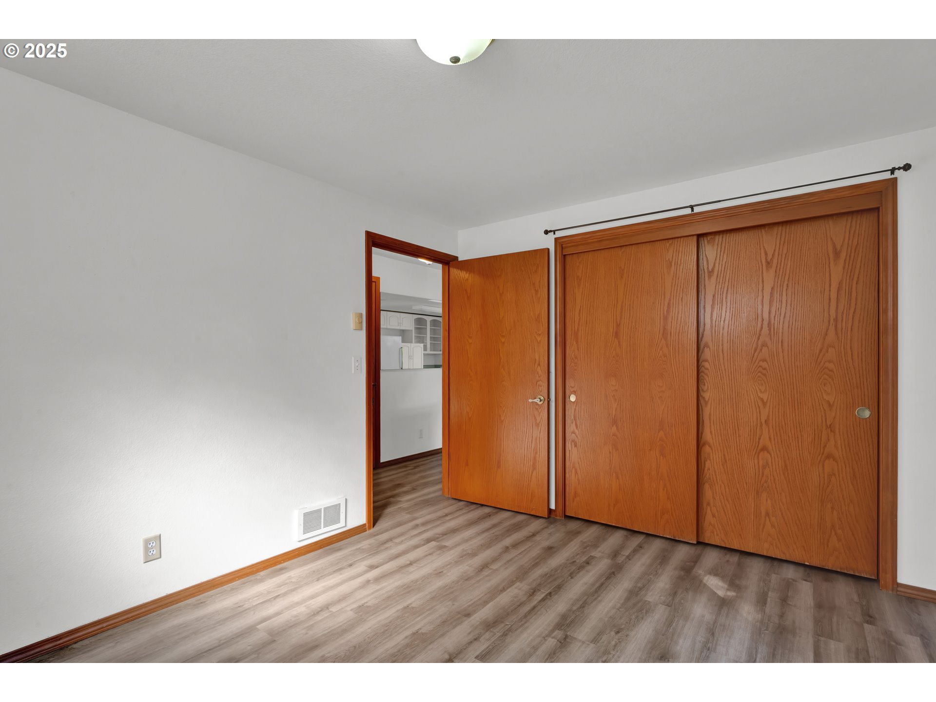 5603 Friendly Acres Road Florence, OR 97439 - Photo 12 of 45 a view of an empty room and wooden floor
