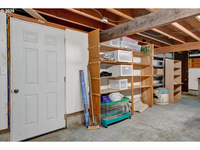 a backyard of a house with barbeque oven table and chairs