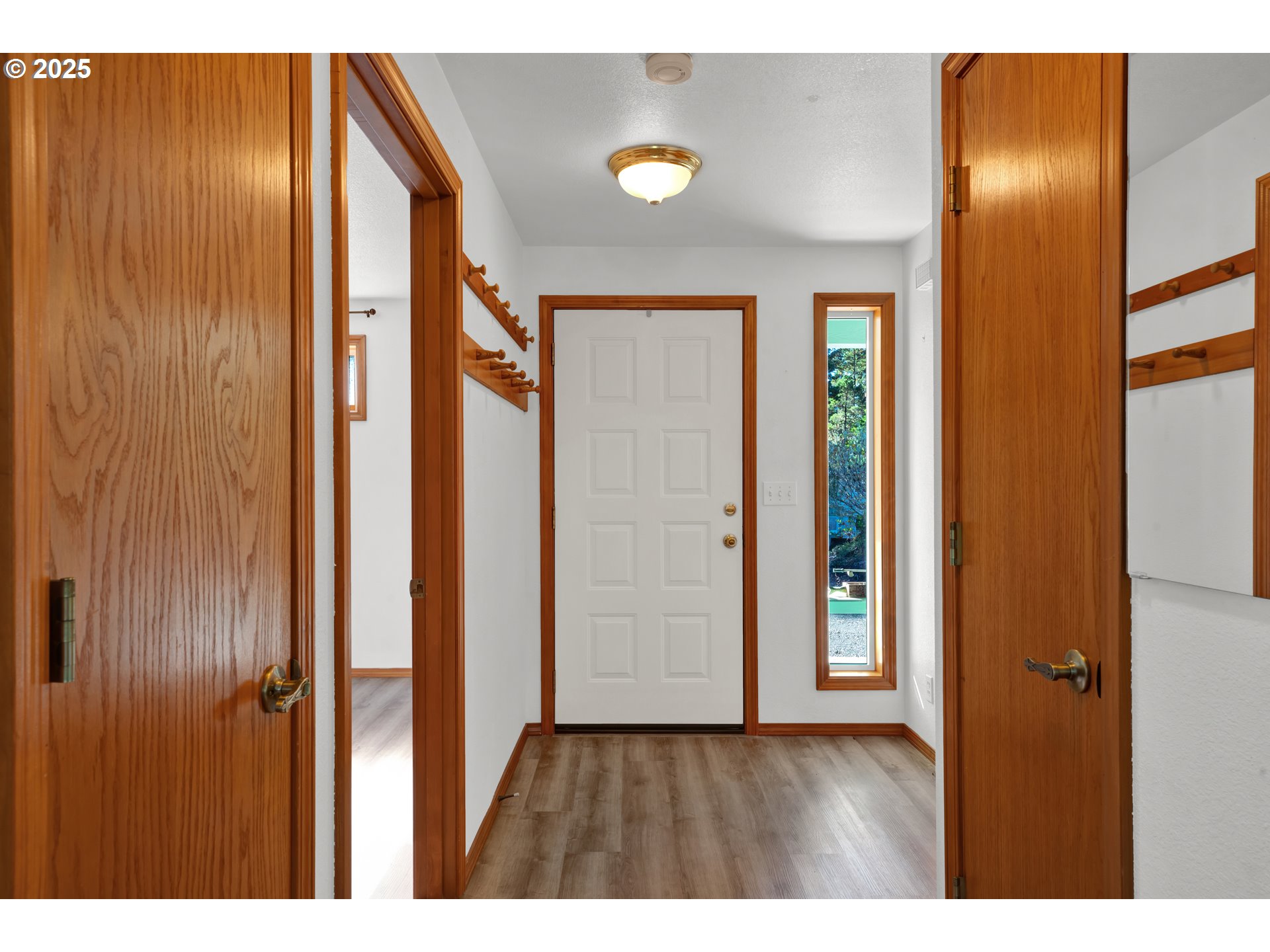 5603 Friendly Acres Road Florence, OR 97439 - Photo 4 of 45 a view of an entryway with wooden floor