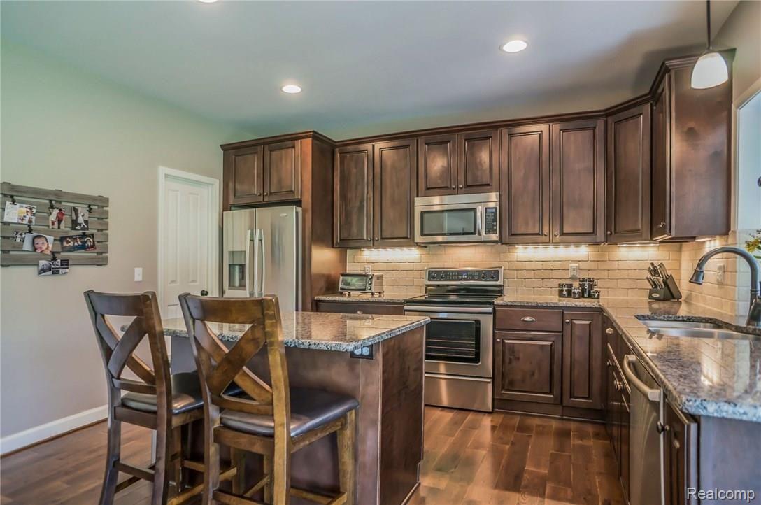 1193 Riverside Street Milford, MI 48381 - Photo 20 of 62 Beautiful back splash with under-cabinet lighting.