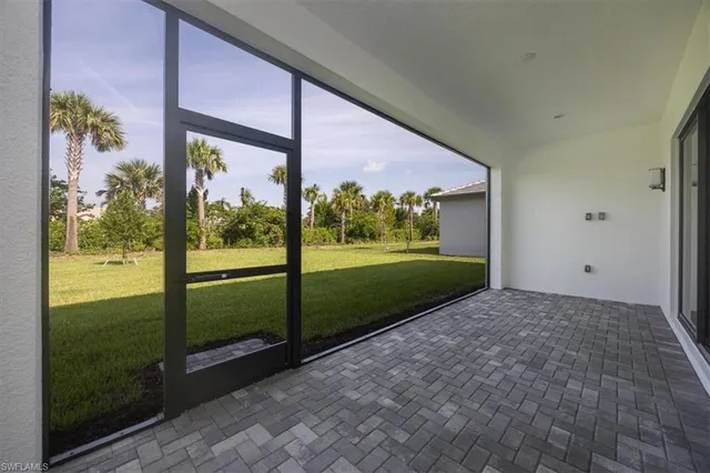 a view of a porch and floor to ceiling window