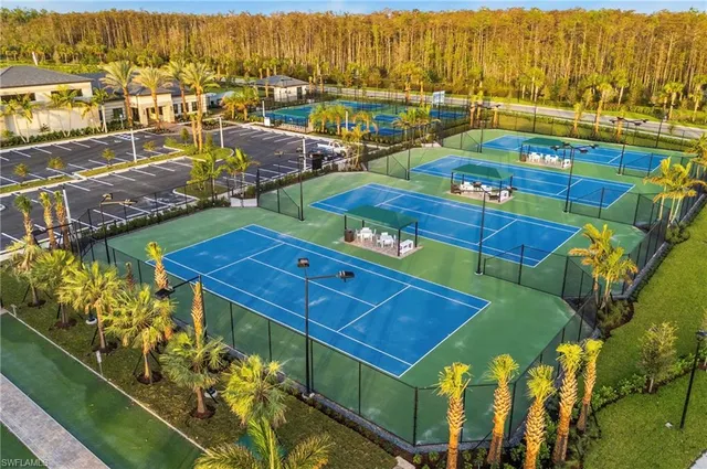 a view of a balcony with chair and a potted plant