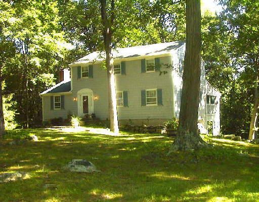47 Woodchuck Lane Ridgefield, CT 06877 - Photo 1 of 1 a view of a house with a yard