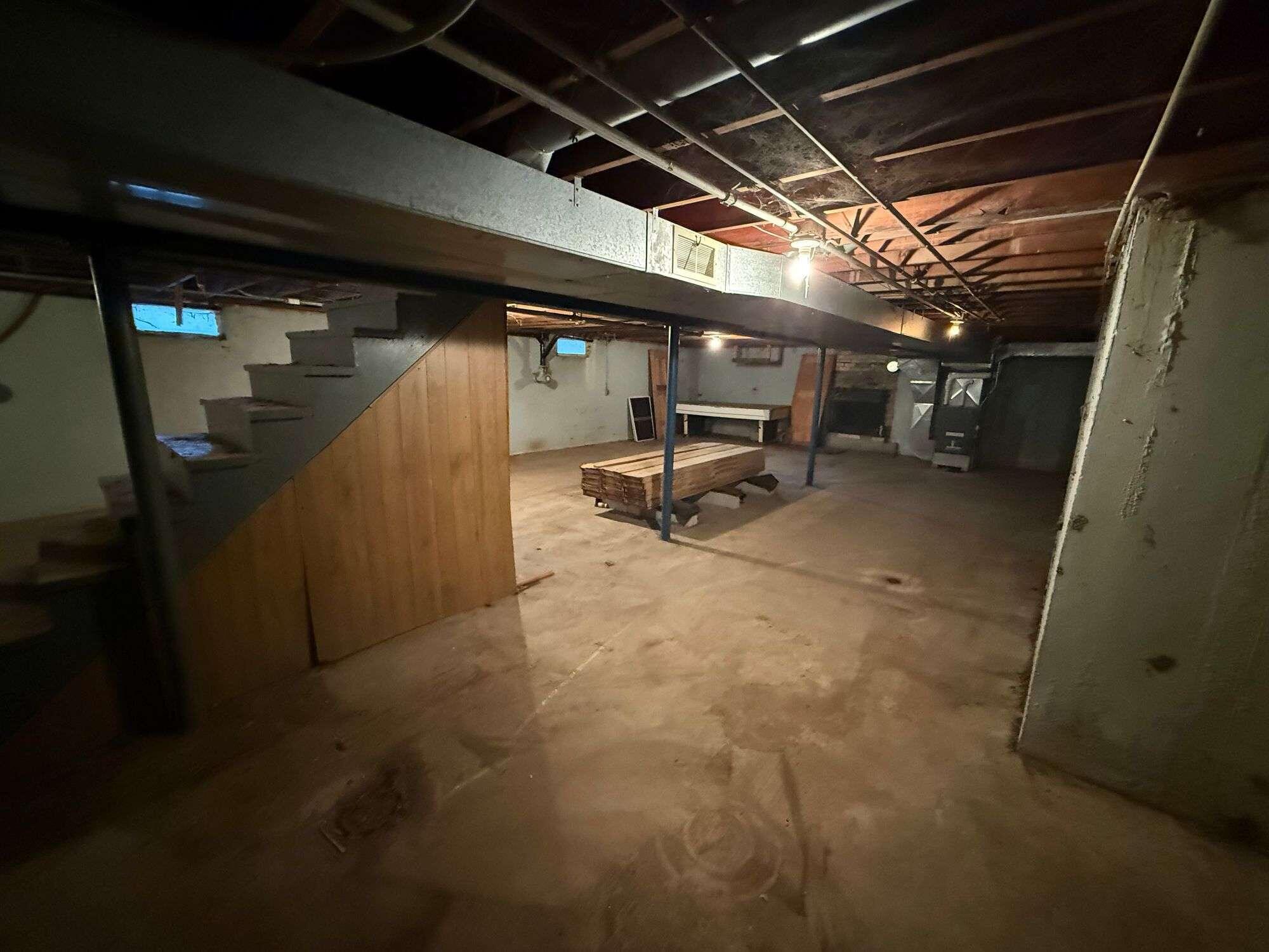 10021 Clay Street Crown Point, IN 46307 - Photo 28 of 30 a view of water heater room with stairs