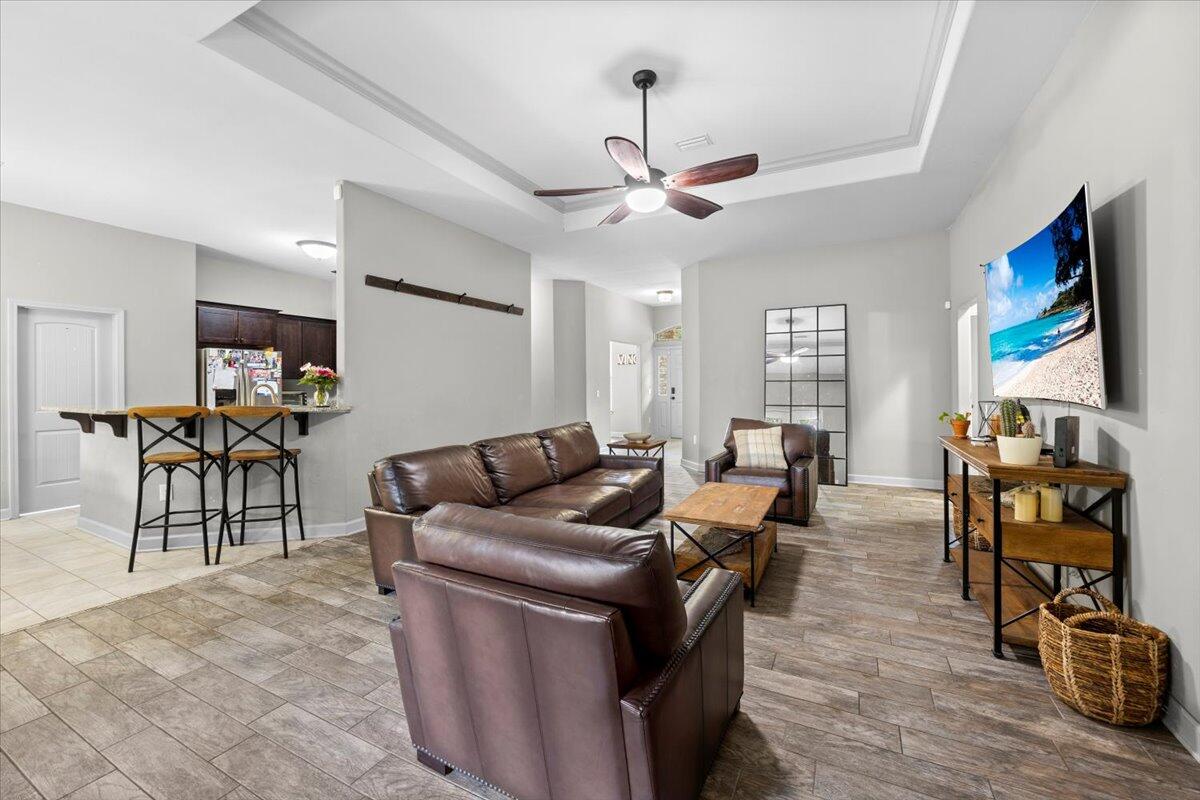 6057 Diamante Drive Crestview, FL 32539 - Photo 11 of 33 a living room with furniture and wooden floor